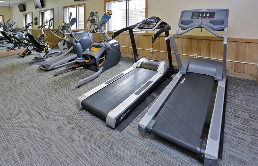 24-hour fitness center equipped with treadmills...